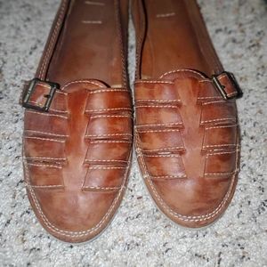 White bottom leather flats.